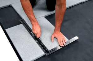 Easy installation process of promenade tiles with interlocking system for secure fit.